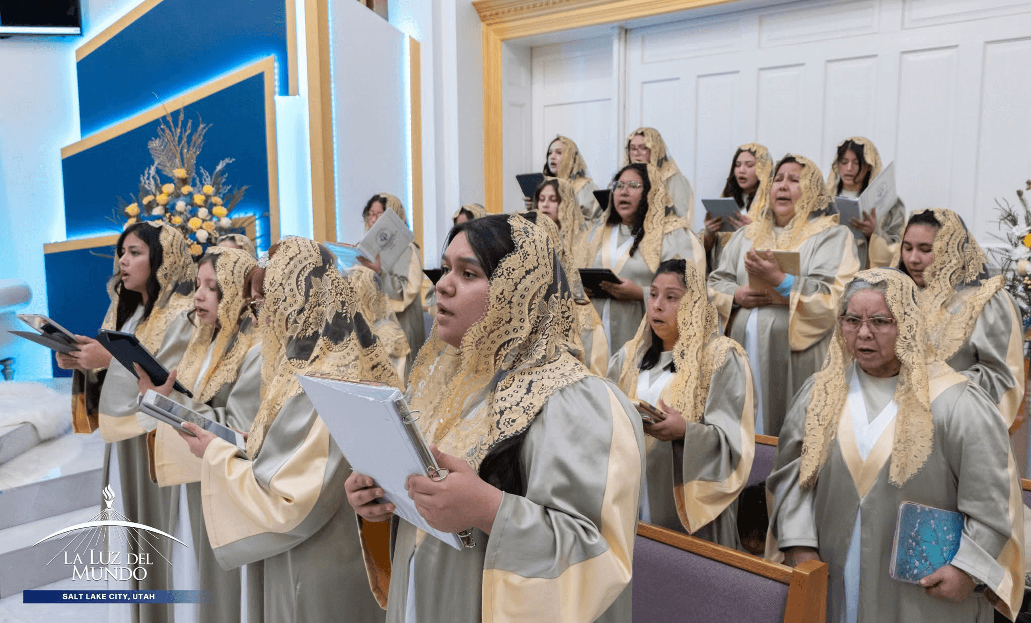 Close-up of choir members in togas and gold veils