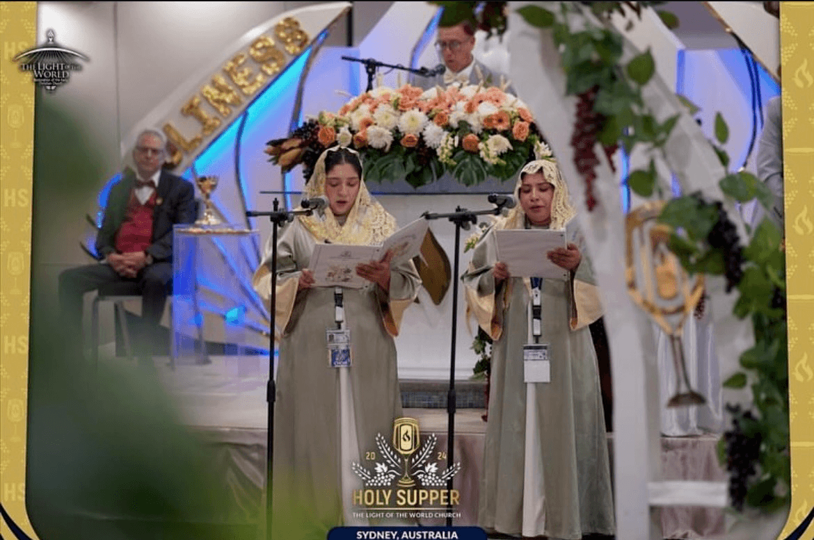 Two choir members singing in RDM uniforms